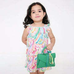 Girl holding green handbag with Fimo Bead Bag Charm - Green Ribbon Bow; ideal clip-on accessory for kids aged 3 to 7.