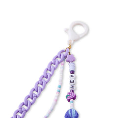 Detailed view of the clip-on clasp and beaded strands of the kids' bag charm, featuring pastel beads and a purple chain. Easy to attach to bags.