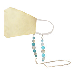 Yellow face mask attached to a kids beaded holder chain featuring blue and iridescent beads, combining fashion and function for children.