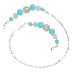 Close-up of kids beaded glasses and mask holder chain with lobster clasps, featuring vibrant blue and translucent beads on a silver link chain.