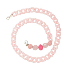 Close-up of pink kids beaded chain with vibrant beads and lobster clasps, perfect for holding glasses or masks securely.