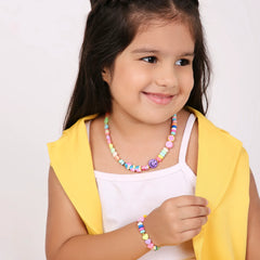 Trendy Beaded Necklace Bracelet Set for Girls & Teens worn by a smiling girl. Colorful beads and charms create a playful, fashionable look.