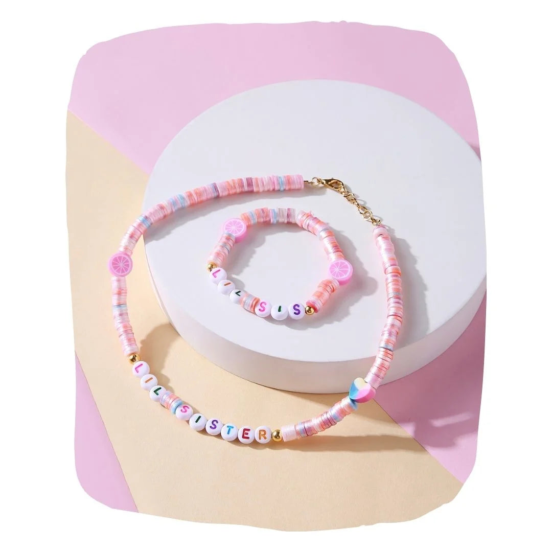 Arendelle Jewelry Set - Kids Personalized | Necklace & Bracelet featuring pink beads and 'LIL SISTER' letter charms, ideal for girls aged 7-12.