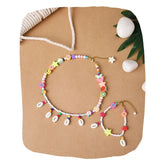 Trendy jewelry set for teens featuring a colorful boho beaded necklace and bracelet with shells and charms, ideal for casual outfits or gifts.