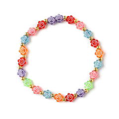 Colorful floral beaded necklace with gold accents, designed for teens as part of a trendy jewelry set with boho and Y2K vibes.