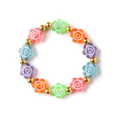 Close-up of floral beaded bracelet with multicolor flowers and gold beads, part of the fun jewelry set for trendy teens.