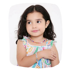 Young girl wearing Personalized Kids Name Jewelry Set with vibrant necklace and bracelet, perfect for stylish and trendy kids' fashion.
