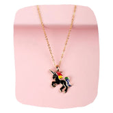 Unicorn Pendant Necklace Girls - Black Enamel Charm with gold chain on pink background, ideal magical jewelry for young girls aged 3 to 7.