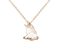 Close-up of Unicorn Pendant Necklace - Kids Jewelry featuring a pink enamel unicorn charm on a delicate gold chain. Perfect for girls aged 3 to 7.
