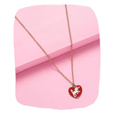 Unicorn Heart Pendant Necklace for Girls with red enamel charm on gold chain, displayed on pink background. Cute kids cartoon animal jewelry gift.