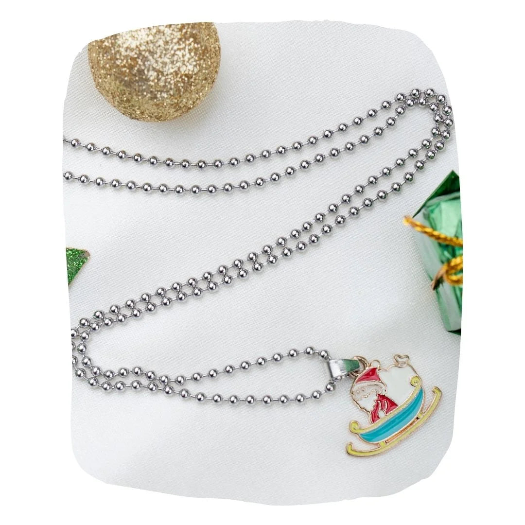 Santa Sleigh Necklace Kids - Christmas Jewelry with festive Santa sleigh charm on silver ball chain, ideal holiday gift for girls ages 3 to 12.