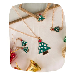 Christmas Jewelry Set with tree pendant, bracelet, earrings, and ring on display. Festive gift for girls featuring green and red holiday design.