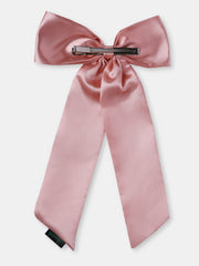 Back view of pastel pink satin silk hair bow showing secure metal clip. Durable and stylish hair accessory for girls.