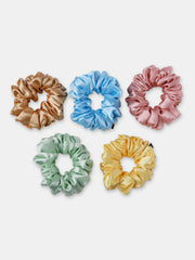 Set of five Silk Satin Scrunchies in pastel tones, perfect for versatile hairstyles and minimizing hair damage. Trendy and eco-friendly hair ties.