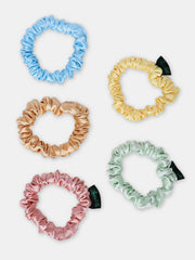 Set of 5 pastel silk satin skinny scrunchies for all hair types, offering smooth hold and reduced breakage in trendy colors.
