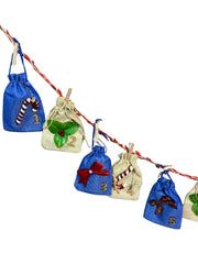 Close-up of Kids' Advent Calendar - Christmas Hair & Jewelry | 12 Fun Days showing detailed holiday-themed designs on small gift bags numbered 1 to 5.