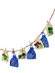 Kids' Advent Calendar - Christmas Hair & Jewelry | 12 Fun Days with bags numbered 6 to 12, decorated with festive icons like holly, bows, and candy canes.