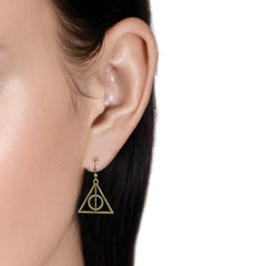 Model wearing Harry Potter inspired bronze earrings