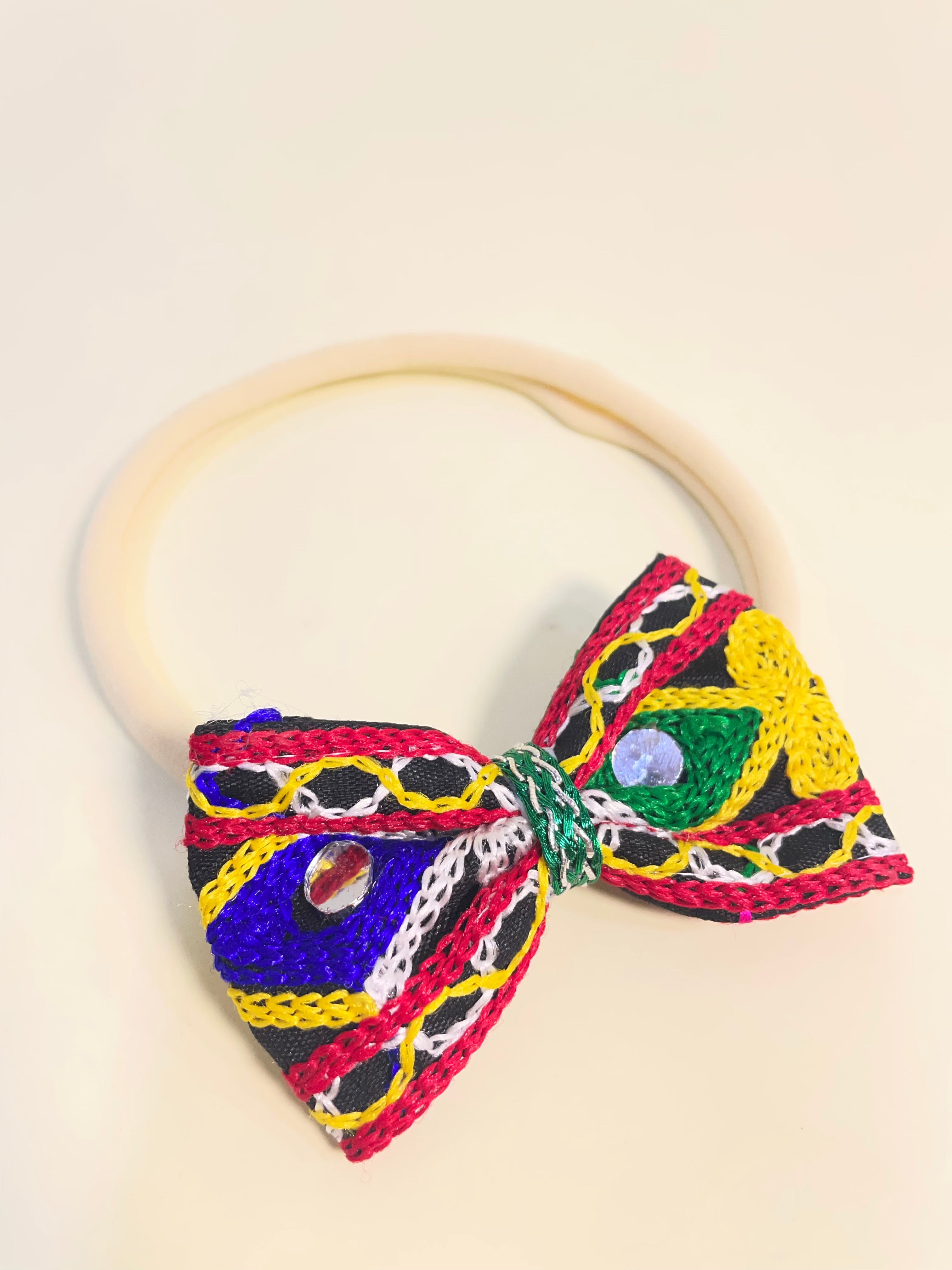 Rangtaari Baby Headband with colorful mirror work and embroidered bow, perfect Navratri hair accessory for girls. Lightweight festive headband.