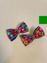 Dholida Bow Clip Set featuring colorful embroidery, mirror work, and tassels, ideal Navratri hair accessories for girls' festive styling.