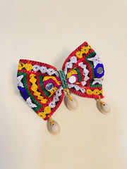Colorful handmade Chogada Big Kodi Bow with mirror work and shell drops, ideal Navratri hair accessory for kids' festive styling.