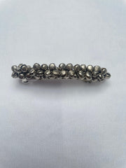 Front close-up of handcrafted Navratri Ghungroo Hair Pin with metallic ghungroo beads. Stylish and festive hair accessory for girls.