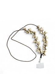 Handcrafted Arendelle Navratri Phone Sling with traditional cowrie shells and black cord, perfect for cultural and festive outfits.