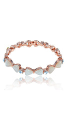 Bow Bracelet Opal Women featuring imitation opal stones and delicate bow accents in a rose gold finish. Lightweight and adjustable for elegant wear.