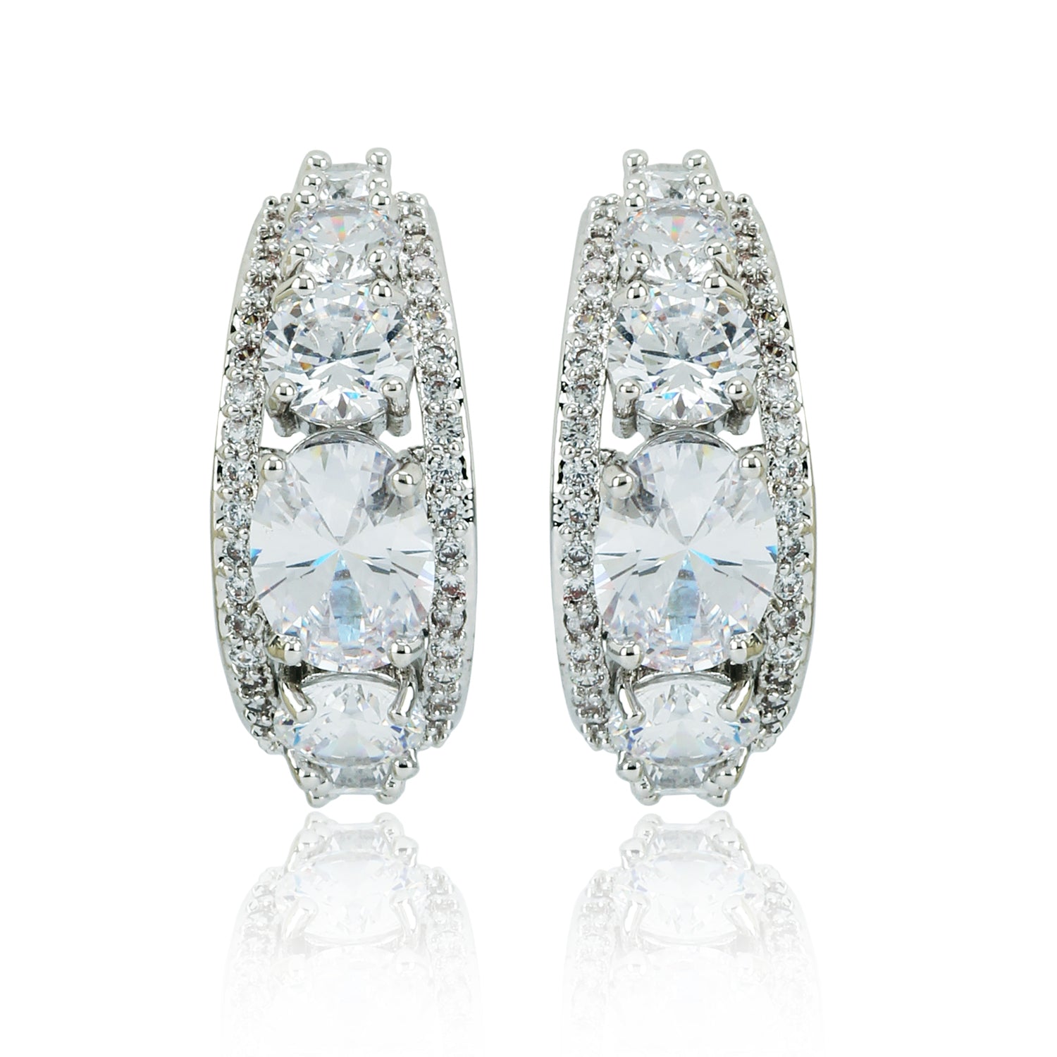 Loop silver earrings with cubic zirconia and brass, featuring a symmetrical row of sparkling stones. Elegant jewelry for formal or casual wear.