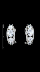 Loop silver earrings with cubic zirconia and brass shown with size scale. Perfect blend of glamour and comfort in a compact design.