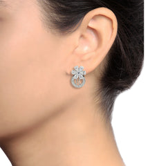 Model wearing Cubic Zirconia and Brass Flower Loop Silver Earrings, highlighting their size and luxurious sparkle for stylish occasions.