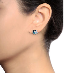Model wearing Genuine Swarovski Elements Blue Heart and Studded Flower Earrings, showcasing their petite size and radiant sparkle on the ear.
