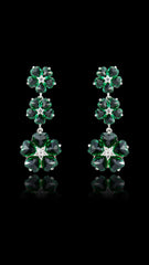 Cubic Zirconia Green Emerald Dangle and Drop Earrings featuring triple flower pattern on black background. Sparkling accessory ideal for gifting.