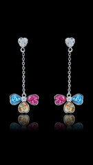Swarovski Dangle Earrings - Colorful Crystals featuring tri-color heart-shaped stones on silver drop chains, displayed on a black background for elegance. Ideal for gifting or special occasions.