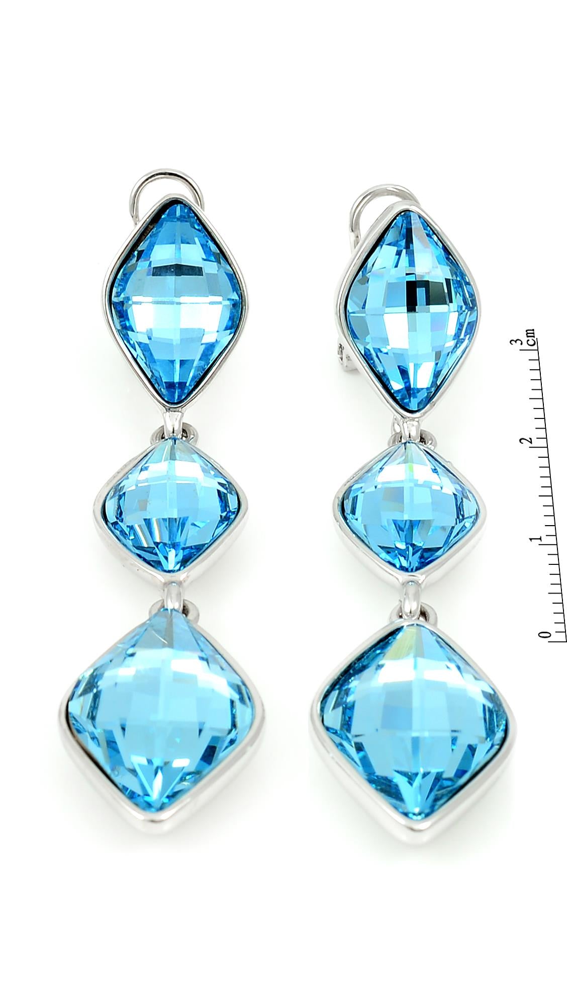 Genuine Swarovski Elements Blue Dangle and Drop Earrings featuring three square-cut crystals in silver-tone settings. Elegant jewelry for formal wear.
