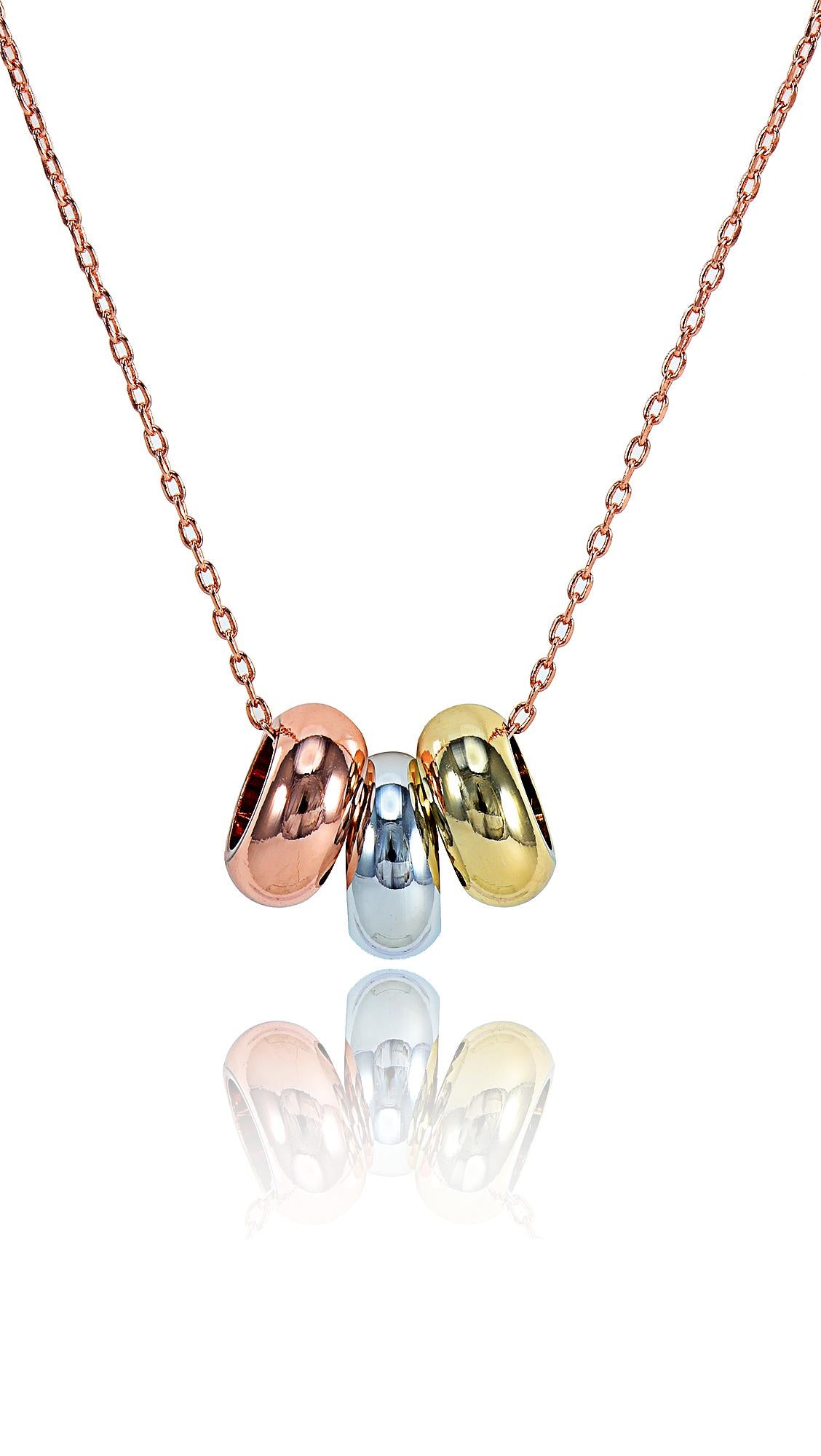 Concentric Opal Pendant necklace featuring rose gold, silver, and gold-tone circular charms on a delicate chain. Minimalist design for elegant wear.