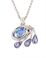 Genuine Swarovski Swan Pendant featuring a silver-tone swan with blue crystal body and teardrop accents. A graceful jewelry set for elegant styling.