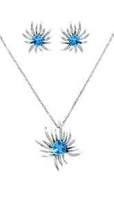 Swarovski Blue Pendant Earrings Set featuring a radiant blue crystal center and silver web design, ideal for elegant evening wear.