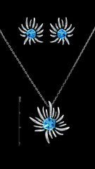 Elegant Swarovski Blue Pendant Earrings Set with genuine elements, showcasing a vivid blue gem and intricate silver detailing on black background.