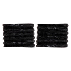 Close-up of Arendelle's black metal bangles set, stacked in two groups, ideal for girls' traditional outfits and festive occasions.