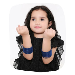 Young girl wearing Blue Metal Bangles Set - Traditional Shining Bangles, showcasing elegant Indian jewelry for kids in a stylish black dress.