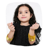Young girl wearing Yellow Metal Bangles Set (36 Pcs) from the Traditional Indian Bangles collection, styled for festive or daily wear.