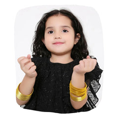 Young girl wearing Yellow Metal Bangles Set (36 Pcs) from the Traditional Indian Bangles collection, styled for festive or daily wear.