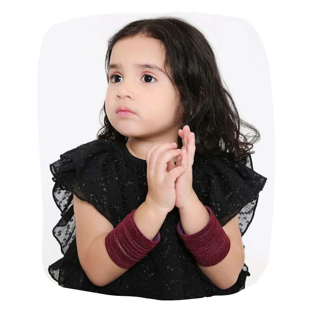 Young girl wearing Wine Velvet Bangles Set 48 Pcs, showcasing classic and festive jewelry for kids. Ideal for special occasions and celebrations.
