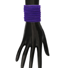 Purple Velvet Bangles Set - 48 Pcs displayed on mannequin hand, showcasing vibrant color and snug fit for traditional attire.