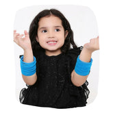 Child wearing Blue Velvet Bangles Set - Velvet Metal Bangles Set | 48 Pcs, 16 Colors. Stylish and comfortable jewelry for kids.