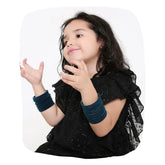 Young girl wearing Greenish Blue Velvet Bangles Set from 48 Pcs collection, ideal for festive wear. Stylish accessory in Apparel & Accessories > Jewelry.