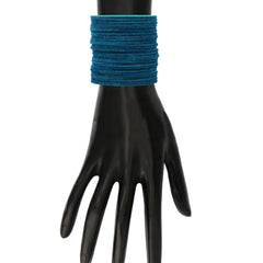 Greenish Blue Velvet Bangles displayed on mannequin hand. Elegant and soft-touch bangles ideal for festive and traditional attire.