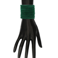 Dark green velvet bangles worn on a mannequin hand, showcasing the elegant ethnic design from the 48 Pc Velvet Metal Bangles Set.