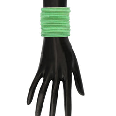 Pista green velvet metal bangles set displayed on mannequin hand, highlighting elegant design and comfortable fit.